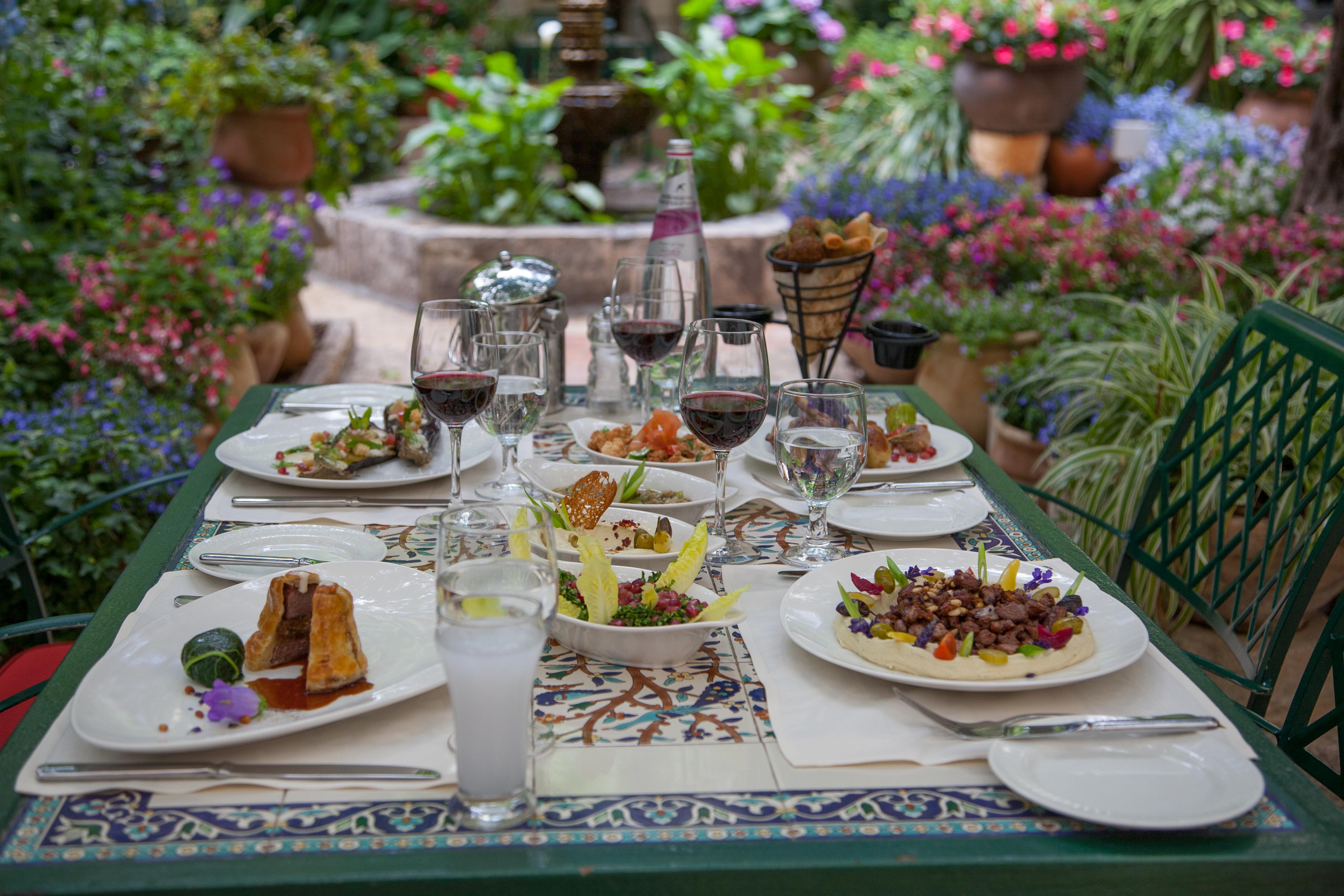 The American Colony Hotel - Small Luxury Hotels Of The World Йерусалим Екстериор снимка A table at the restaurant